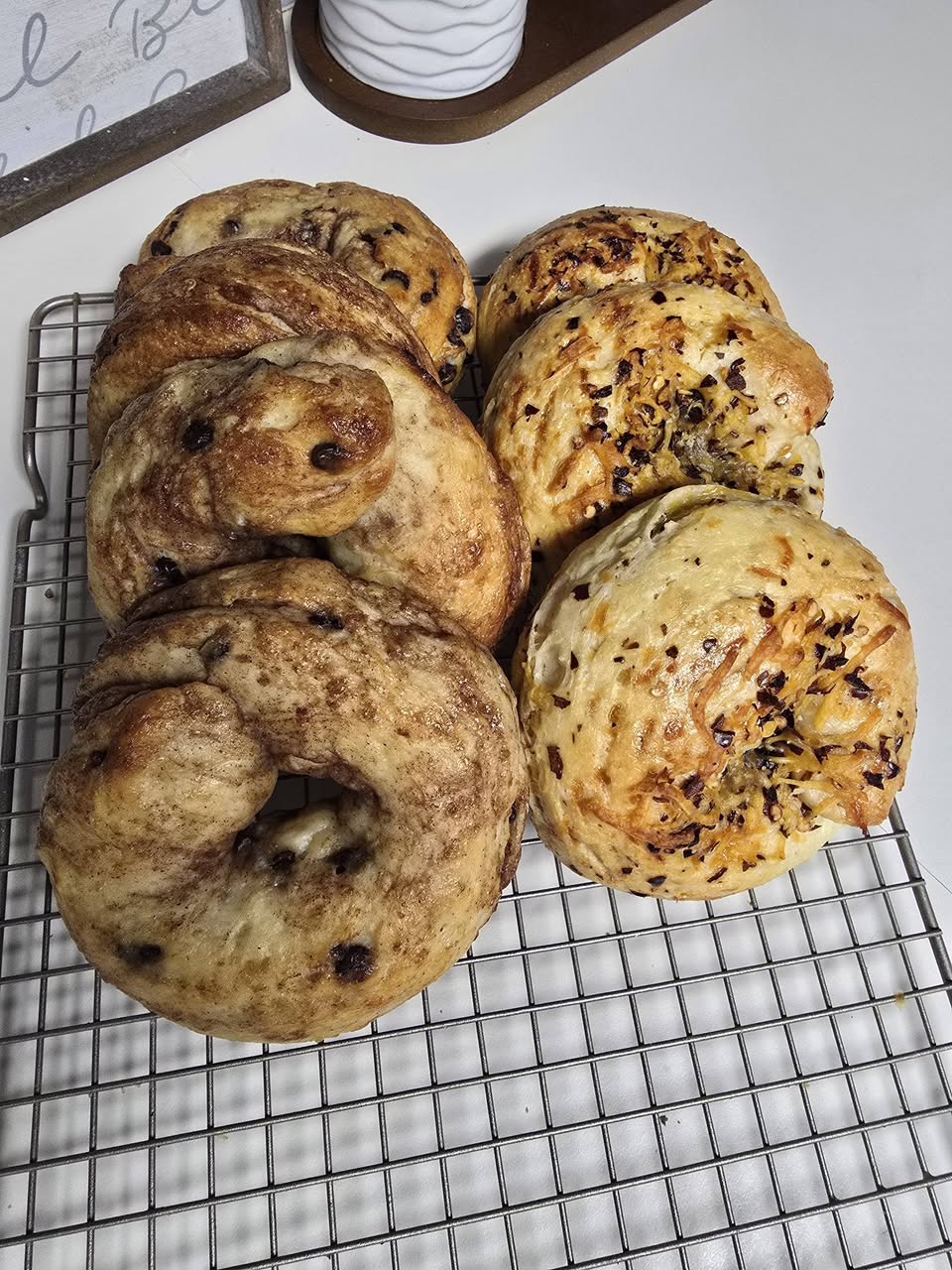 Fresh-baked protein bagels on a cooling rack