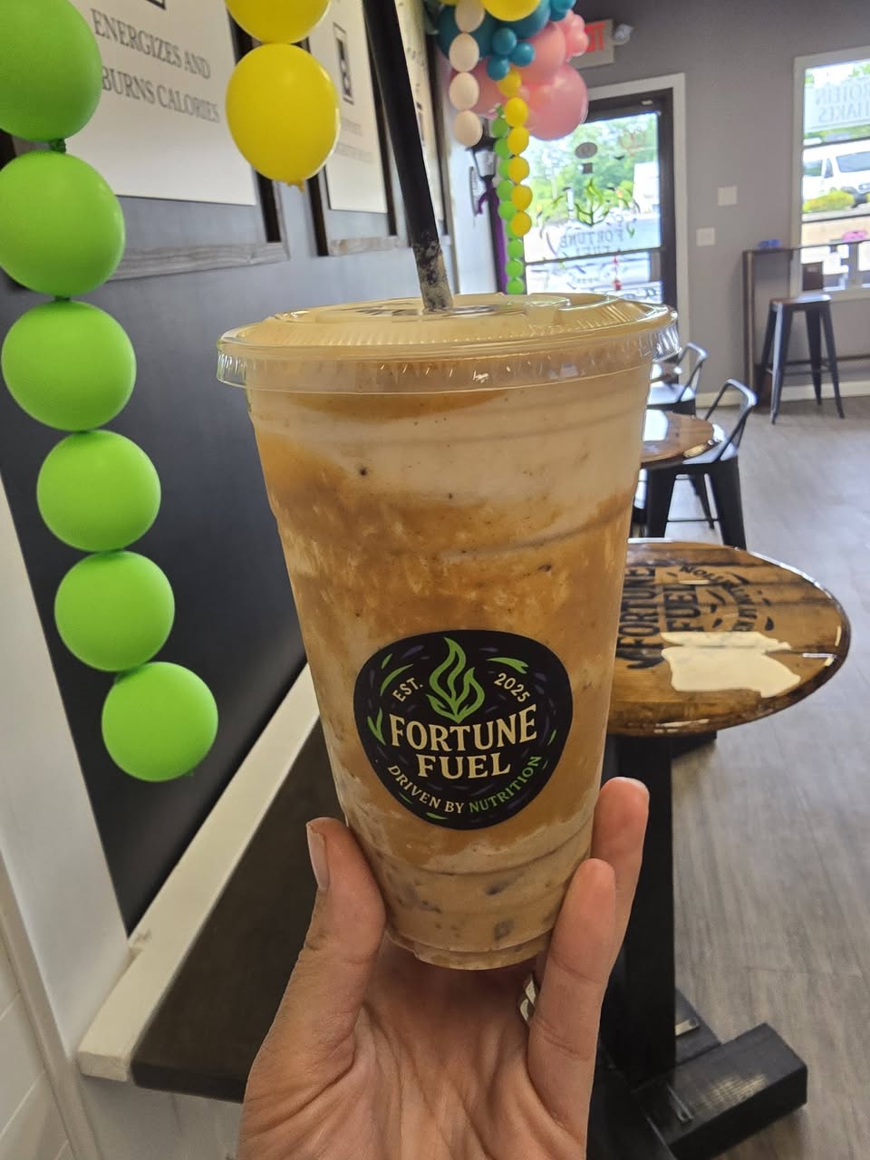 An iced protein coffee in a Fortune Fuel cup
