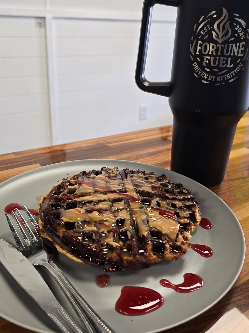 A fresh protein waffle with drizzle on a plate at Fortune Fuel
